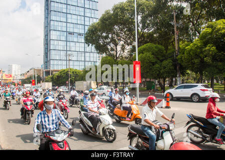 There are over 45 million scooters motorbikes in Vietnam.Typical scene from Ho Chi Minh ( Saigon) city centre with commuters. Stock Photo