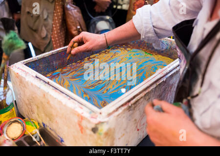 Paper marbling is a method of aqueous surface design, which can produce patterns similar to smooth marble or other stone. Ebru - Stock Photo