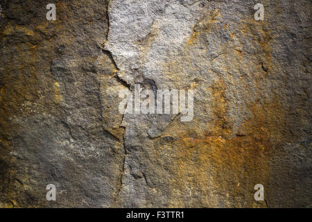 A face seems carved in the rock, but in fact is the work of nature itself. Stock Photo