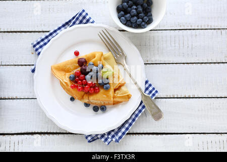 sweet pancakes and berries mix, top view Stock Photo