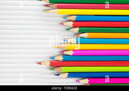 Colorful pencils on white cardboard.Creativity abstract Stock Photo