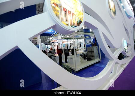 (151013) -- HARBIN, Oct. 13, 2015 (Xinhua) -- Visitors look at a welding robot during the second China-Russia Exposition in Harbin, northeast China's Heilongjiang Province, Oct. 13, 2015. Nearly 10,000 businessmen from 103 countries and regions attended the expo. The event will last till Oct. 16, 2015.(Xinhua/Wang Song)  (zhs) Stock Photo