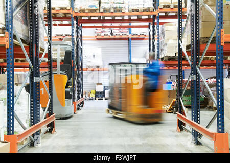 warehouse truck loader works Stock Photo