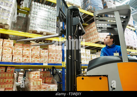 warehouse stacker loader worker Stock Photo