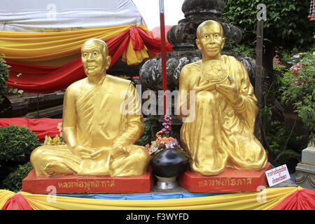 Two golden monks Stock Photo