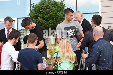 Matteo Darmian and Morgan Schneiderlin mobbed by fans as they arrive back at their hotel after Training.  Featuring: Matteo Darmian, Morgan Schneiderlin Where: Manchester, United Kingdom When: 12 Aug 2015 Stock Photo