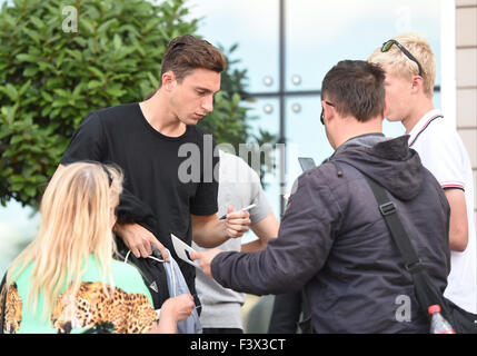 Matteo Darmian and Morgan Schneiderlin mobbed by fans as they arrive back at their hotel after Training.  Featuring: Matteo Darmian Where: Manchester, United Kingdom When: 12 Aug 2015 Stock Photo