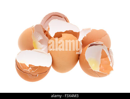 A group of broken and used brown eggshells isolated on a white background. Stock Photo