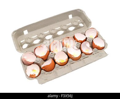 A dozen broken eggshells in an opened cardboard container on a white background. Stock Photo