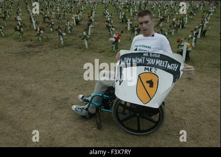 Tomas Young, who was injured on the same day as Casey Sheehan was killed, says he would like to have a meeting with George W. Bush about stem cell research. Young was paralyzed when he was shot while riding in a truck. He holding a sign while sitting in his wheelchair during anti-war protests in Crawford Texas. Stock Photo