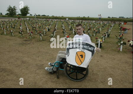 Tomas Young, who was injured on the same day as Casey Sheehan was killed, says he would like to have a meeting with George W. Bush about stem cell research. Young was paralyzed when he was shot while riding in a truck. He holding a sign while sitting in his wheelchair during anti-war protests in Crawford Texas. Stock Photo