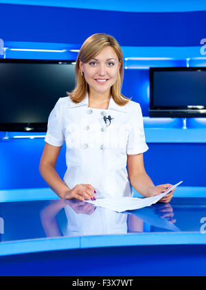 television newscaster at TV studio Stock Photo