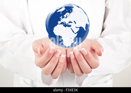 doctor woman holding globe on her hands Stock Photo