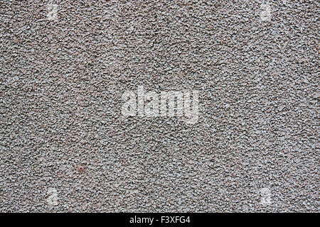 Gray wall with fine gravel Stock Photo