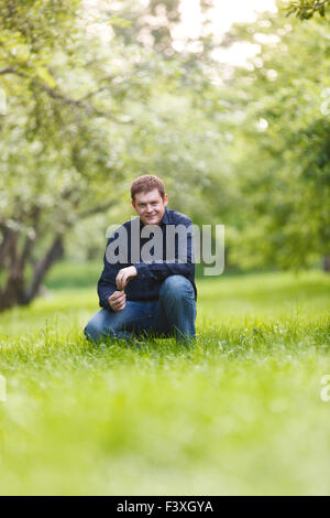 Middle-aged man resting in the city park Stock Photo