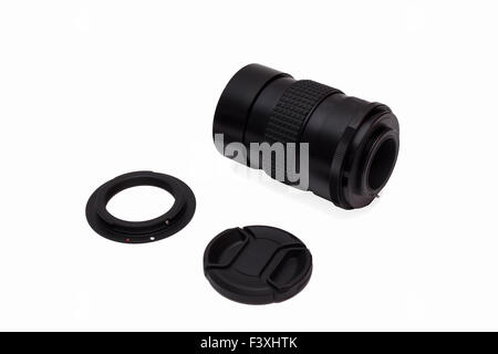 Lens with an adapter and a protective cover on a white background. Stock Photo