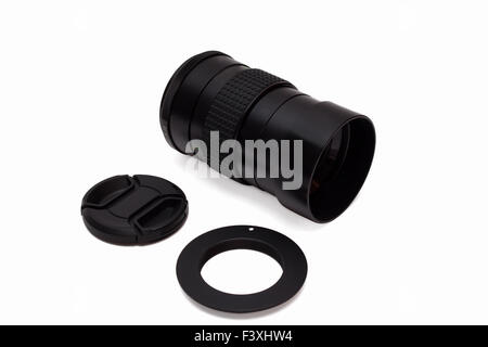 Lens with an adapter and a protective cover on a white background. Stock Photo