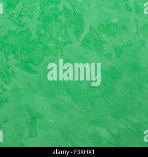 Background of green Venetian plaster. Stock Photo
