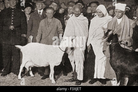 Mahatma Gandhi arrives in London, England in 1931 with his disciple, Madeleine Slade, and his two goats.  Mohandas Karamchand Gandhi, 1869 – 1948.  Leader of the Indian independence movement in British-ruled India. Madeleine Slade aka Mirabehn, 1892 – 1982.  British woman who left her home in Britain to live and work with Gandhi. Stock Photo