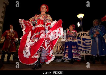 A member of Zhivaya Rus swirls her folk skirt dress during her live dance show in Myrina city, Limnos island. Stock Photo