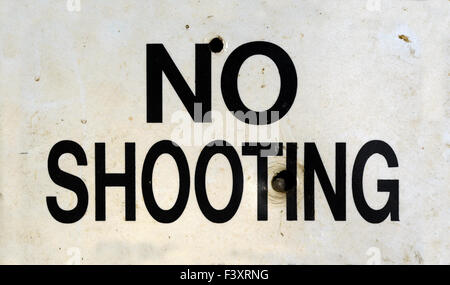 Damaged No Shooting Sign Stock Photo