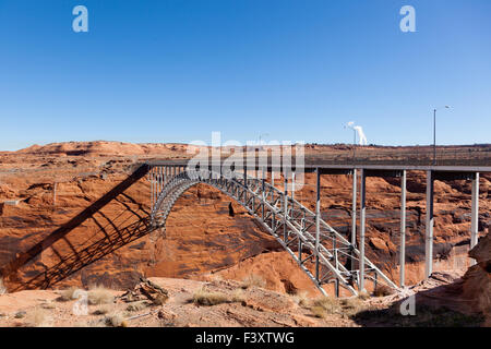 The Glen Canyon Dam Bridge arching across the red rock above the Colorado River in Page, Arizona. Stock Photo