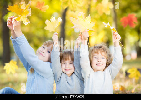 Children in autumn park Stock Photo