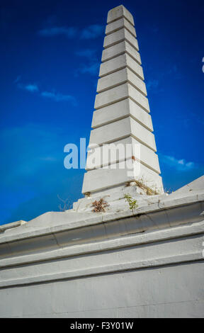 Marble Obelisk atop grave in the oldest and most famous cemetery in the Archdiocesan, the  St. Louis Number One, New Orleans, LA Stock Photo