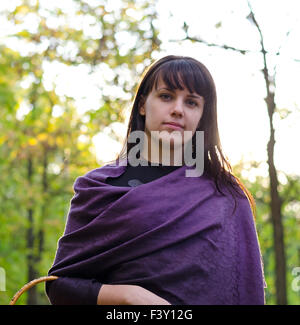 Young woman wearing a purple shawl Stock Photo
