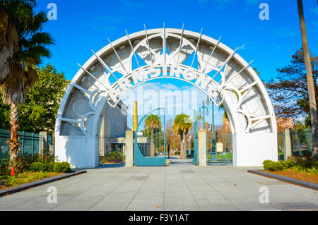The circular iron gate and Metal archway entrance to the impressive Armstrong Park in the Treme area of New Orleans, LA Stock Photo