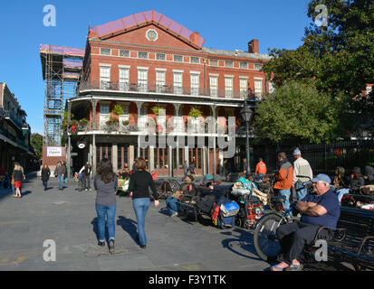 People walking towards the Pontalba Apartment Building in Jackson Square, French Quarter, New Orleans, LA, USA Stock Photo