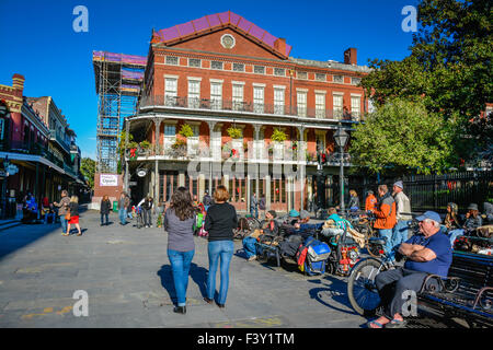 People watching and gathering near the Pontalba Apartment Building in the French Quarter, near Jackson Square in New Orleans, LA Stock Photo