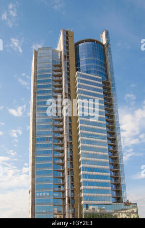 Skyscraper on  background of blue sky. Stock Photo