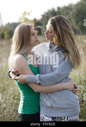 Two loving sisters comforting each other Stock Photo