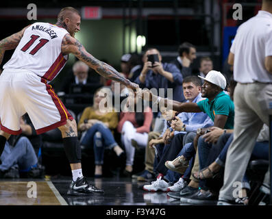 Oct. 12, 2015 - Miami, Florida, U.S. - Miami Heat forward Chris Andersen (11) shakes hands with boxer Floyd Mayweather, Jr. during a time out at AmericanAirlines Arena in Miami, Florida on October 12, 2015. (Credit Image: © Allen Eyestone/The Palm Beach Post via ZUMA Wire) Stock Photo