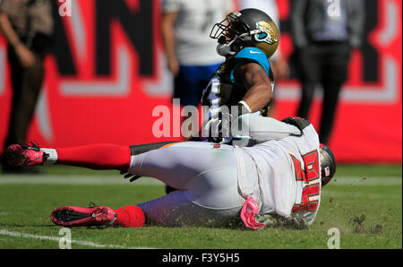 Oct. 11, 2015 - Tampa, Florida, U.S. - DIRK SHADD   |   Times  .Tampa Bay Buccaneers defensive end George Johnson (94) tackles Jacksonville Jaguars running back Corey Grant (33) and causes a fumble recovered by Buccaneers defensive end Jacquies Smith (56) who takes it three yards for a touchdown during second half action at Raymond James Stadium Sunday afternoon in Tampa (10/11/15) (Credit Image: © Dirk Shadd/Tampa Bay Times via ZUMA Wire) Stock Photo