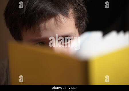 Young boy reading a book Stock Photo