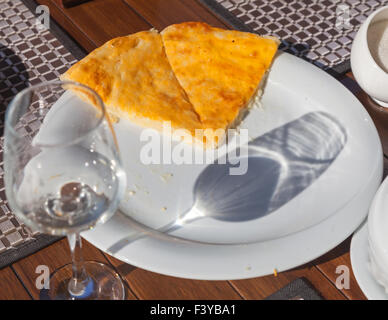 Imeretian khachapuri on white dish Stock Photo
