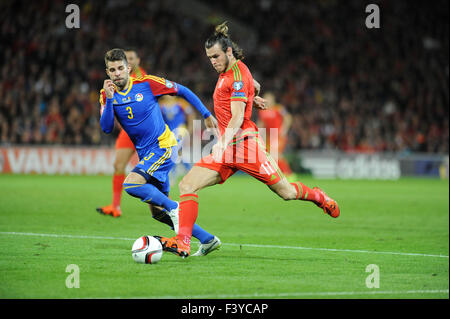 Cardiff, Wales, UK. 13th October, 2015. Euro 2016 qualifying round. Gareth Bale of Wales is tackled by Moises San Niclolas of Andorra at the Cardiff City Stadium tonight. Credit:  Phil Rees/Alamy Live News Stock Photo