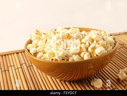 popcorn in bowl isolated in white background Stock Photo