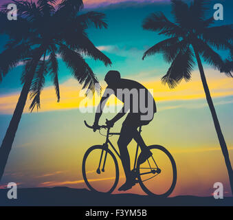 Retro Style Palms And Cyclist Stock Photo