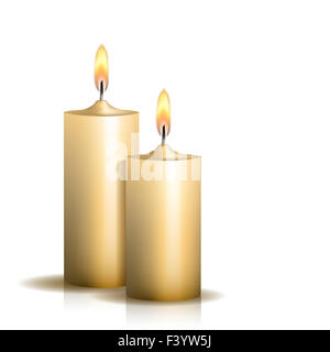 Two burning candles on white background. Stock Photo