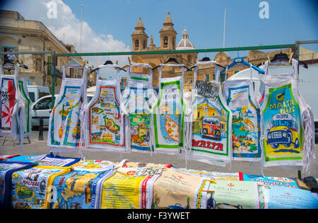 Kitchen aprons for sale to tourists at Marsaxlokk Sunday market Malta Stock Photo