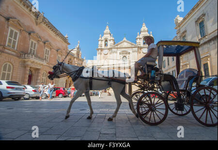 Horse and carriage in the streets of M'dina the 'silent city' and ancient capital of the Mediterranean island  Malta Stock Photo