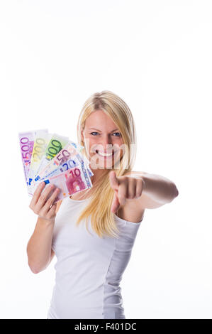 Blonde holds money in hand Stock Photo