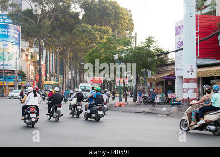 There are over 45 million scooters motorbikes in Vietnam.Typical scene from Ho Chi Minh ( Saigon) city centre with commuters. Stock Photo