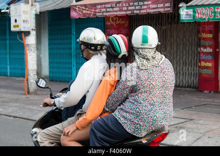 There are over 45 million scooters motorbikes in Vietnam.Typical scene from Ho Chi Minh ( Saigon) city centre with commuters. Stock Photo