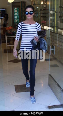 Janice Dickinson shopping for new sunglasses in Beverly Hills wearing star patterned shoes and a striped top  Featuring: Janice Dickinson Where: Los Angeles, California, United States When: 12 Aug 2015 Stock Photo