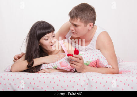 Girl surprised by a marriage proposal Stock Photo