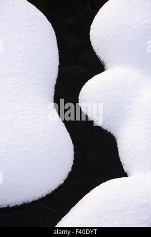 snow covered stones, Lapland, Sweden Stock Photo